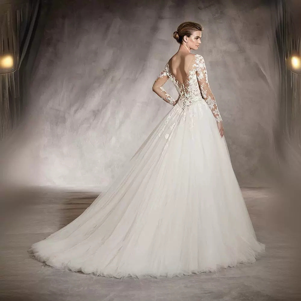 Long-sleeved wedding dress 2024 new style princess puffy skirt European and American retro lace slim fit nude color A-line tail
