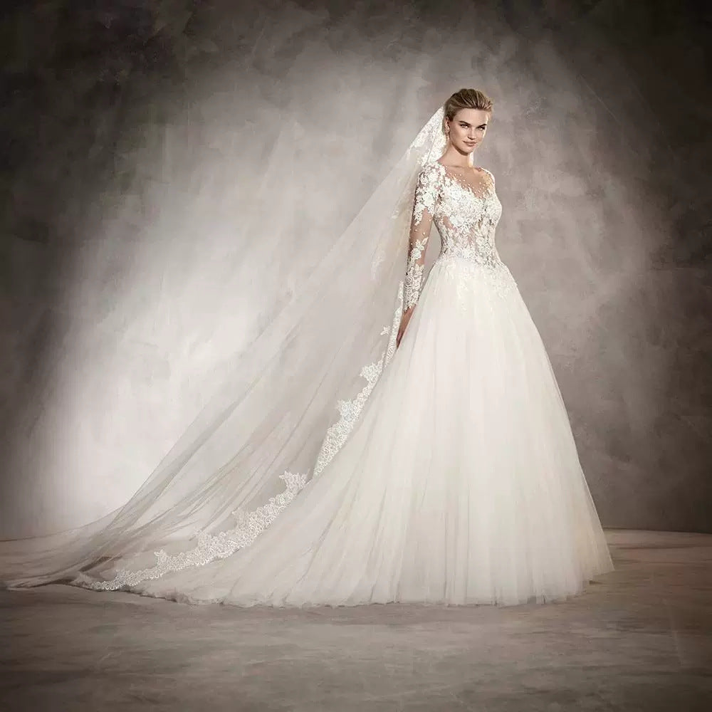 Long-sleeved wedding dress 2024 new style princess puffy skirt European and American retro lace slim fit nude color A-line tail