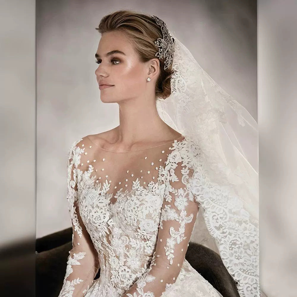 Long-sleeved wedding dress 2024 new style princess puffy skirt European and American retro lace slim fit nude color A-line tail