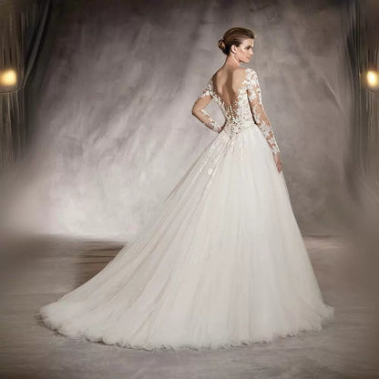 Long-sleeved wedding dress 2024 new style princess puffy skirt European and American retro lace slim fit nude color A-line tail