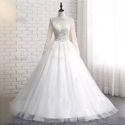 Long-sleeved wedding dress 2024 new style princess puffy skirt European and American retro lace slim fit nude color A-line tail