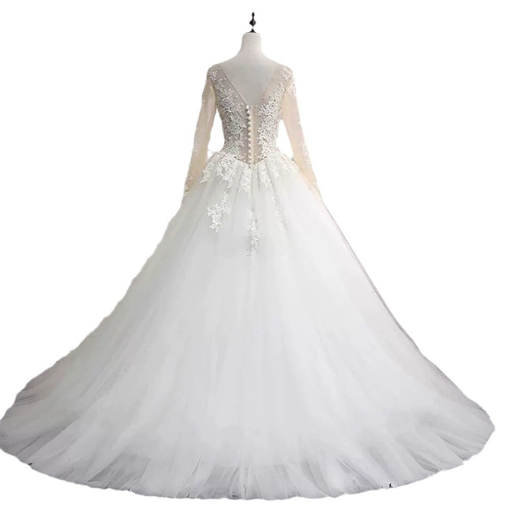 Long-sleeved wedding dress 2024 new style princess puffy skirt European and American retro lace slim fit nude color A-line tail
